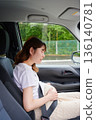Driving woman, pregnant woman, child 136140781