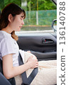 Driving woman, pregnant woman, child 136140788