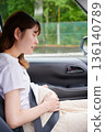 Driving woman, pregnant woman, child 136140789