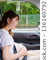 Driving woman, pregnant woman, child 136140792