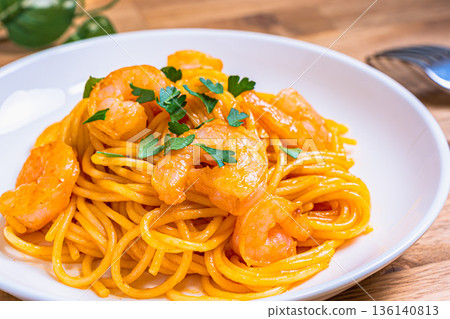 Shrimp tomato cream pasta Western food served on a white plate 136140813