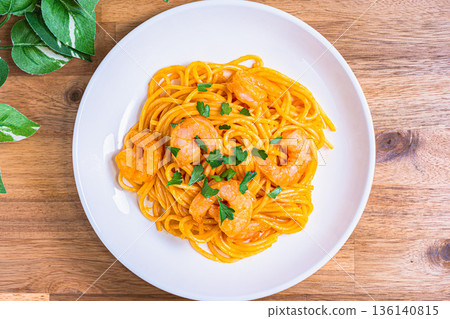 Shrimp tomato cream pasta Western food served on a white plate Shrimp tomato cream pasta Western food served on a white plate 136140815