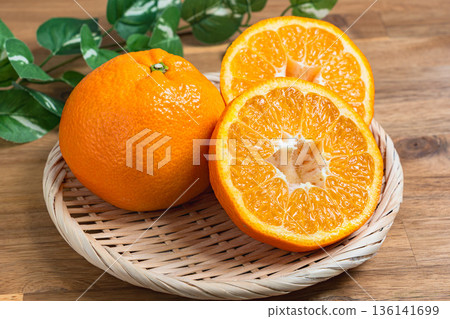 Iyokan oranges served on a bamboo basket 136141699