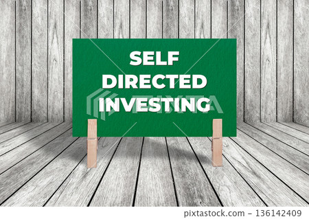 Concept words Self Directed Investing, Dark Green Texture Rectangle Card Held By Clothespin Wooden Texture Background, Business and Self Directed Investing Theme 136142409