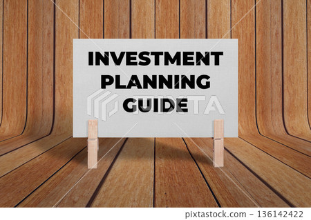 Concept words Investment Planning Guide, Gray Rectangle Card Held By Clothespin Wooden Texture Background, Business and Investment Planning Guide Theme Concept words Investment Planning Guide, Gray Rectangle Card Held By Clothespin Wooden Texture Background, Business and Investment Planning Guide Theme 136142422
