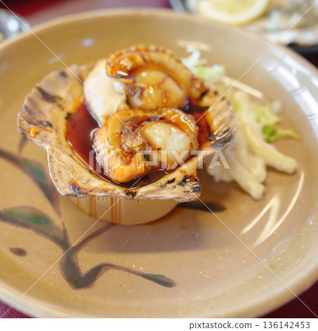 grilled Scallop in Matsushima fish market, seafood famous and popular of Matsushima bay in Miyagi Prefecture, Tohoku, Japan grilled Scallop in Matsushima fish market, seafood famous and popular of Matsushima bay in Miyagi Prefecture, Tohoku, Japan 136142453