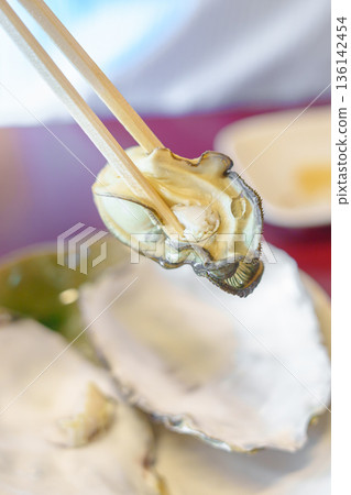 grilled Oyster in Matsushima fish market, seafood famous and popular of Matsushima bay in Miyagi Prefecture, Tohoku, Japan 136142454