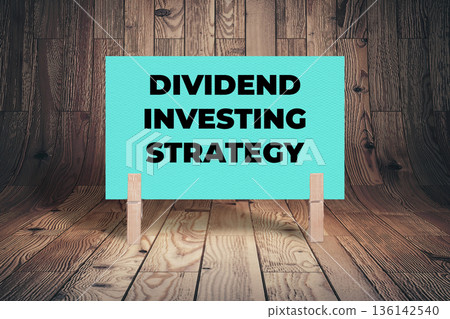 Concept words Dividend Investing Strategy, Aquamarine Concrete Texture Rectangle Card Held By Clothespin Wooden Texture Background, Business and Dividend Investing Strategy Theme Concept words Dividend Investing Strategy, Aquamarine Concrete Texture Rectangle Card Held By Clothespin Wooden Texture Background, Business and Dividend Investing Strategy Theme 136142540