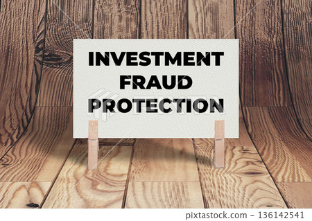 Concept words Investment Fraud Protection, White Concrete Texture Rectangle Card Held By Clothespin Wooden Texture Background, Business and Investment Fraud Protection Theme Concept words Investment Fraud Protection, White Concrete Texture Rectangle Card Held By Clothespin Wooden Texture Background, Business and Investment Fraud Protection Theme 136142541