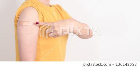 Adult Woman with bandage after received vaccine. Vaccination and Immunization for Influenza, HPV, Zoster, IPD, DTP or Diphtheria, Tetanus and Pertussis, MMR, Hepatitis B, Covid and Nipha virus vaccine Adult Woman with bandage after received vaccine. Vaccination and Immunization for Influenza, HPV, Zoster, IPD, DTP or Diphtheria, Tetanus and Pertussis, MMR, Hepatitis B, Covid and Nipha virus vaccine 136142558