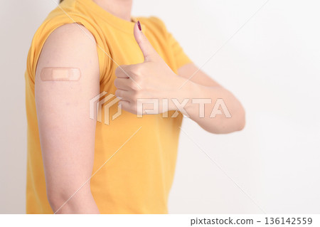 Adult Woman with bandage after received vaccine. Vaccination and Immunization for Influenza, HPV, Zoster, IPD, DTP or Diphtheria, Tetanus and Pertussis, MMR, Hepatitis B, Covid and Nipha virus vaccine Adult Woman with bandage after received vaccine. Vaccination and Immunization for Influenza, HPV, Zoster, IPD, DTP or Diphtheria, Tetanus and Pertussis, MMR, Hepatitis B, Covid and Nipha virus vaccine 136142559
