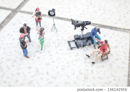 Miniature Film Crew Working Together On Tiled Surface Miniature Film Crew Working Together On Tiled Surface 136142950