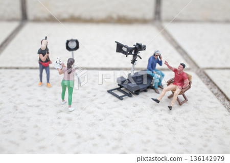 Miniature Film Crew Working Together On Tiled Surface Miniature Film Crew Working Together On Tiled Surface 136142979