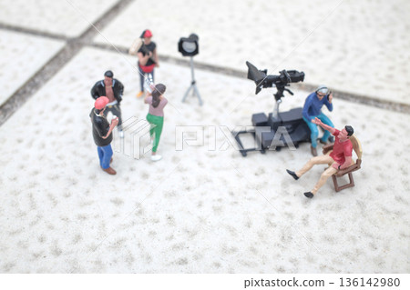 Miniature Film Crew Working Together On Tiled Surface Miniature Film Crew Working Together On Tiled Surface 136142980