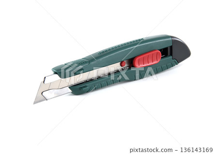 Sharp utility knife with retractable blade and red slider on a white background Sharp utility knife with retractable blade and red slider on a white background 136143169