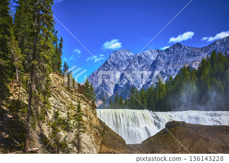 Wapta Falls Waterfall and Rocky Mountains in Yoho National Park Canada Wapta Falls Waterfall and Rocky Mountains in Yoho National Park Canada 136143228
