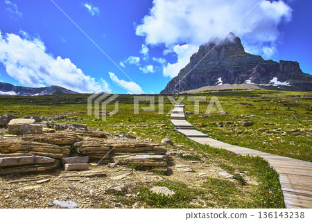 Boardwalk Trail Leading to Mountain Peak Under Blue Sky and Clouds Boardwalk Trail Leading to Mountain Peak Under Blue Sky and Clouds 136143238
