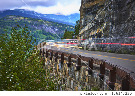 Going to the Sun Road Light Trails on Mountain Cliff in Lush Montana Landscape 136143239