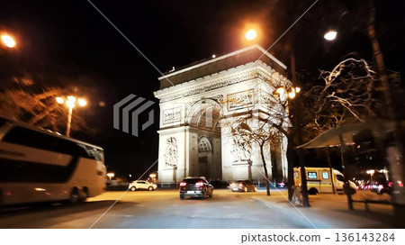 Paris, France - March 15 2023: Gorgeous Arc de Triomphe day and night Paris, France - March 15 2023: Gorgeous Arc de Triomphe day and night 136143284