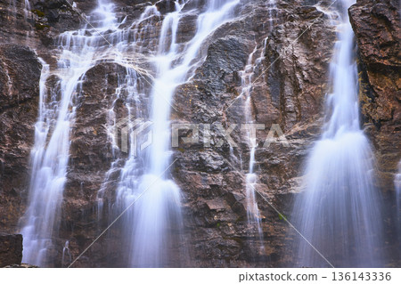 Tangle Falls Waterfall Cascading Over Rocky Cliff in Jasper Canada Tangle Falls Waterfall Cascading Over Rocky Cliff in Jasper Canada 136143336