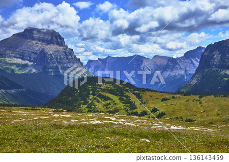 Mountain Peaks and Alpine Meadow under Dramatic Clouds in Summer Mountain Peaks and Alpine Meadow under Dramatic Clouds in Summer 136143459