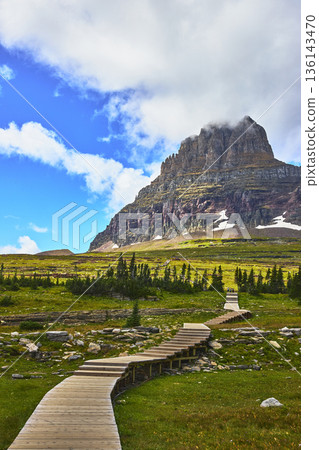 Mountain Boardwalk Trail and Alpine Meadow Under Blue Sky Mountain Boardwalk Trail and Alpine Meadow Under Blue Sky 136143470