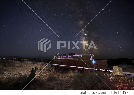 Milky Way Night Sky Over Train Sculpture With Light Painting Nevada Desert Milky Way Night Sky Over Train Sculpture With Light Painting Nevada Desert 136143583