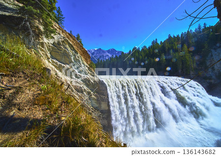Wapta Falls Waterfall and Forest with Mountain Backdrop in Yoho National Park Wapta Falls Waterfall and Forest with Mountain Backdrop in Yoho National Park 136143682