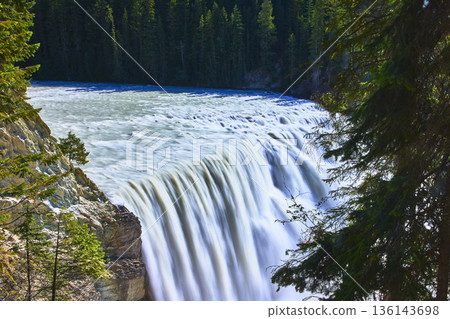 Wapta Falls Waterfall Flowing Through Forest in Sunlight Canada Nature Landscape Wapta Falls Waterfall Flowing Through Forest in Sunlight Canada Nature Landscape 136143698