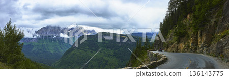 Going-to-the-Sun Road Curve with Lush Mountains and Dramatic Clouds Panorama 136143775