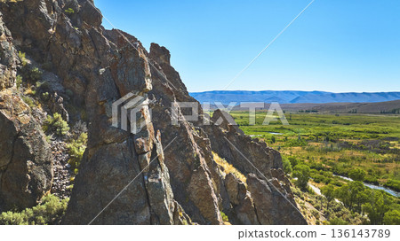 Rocky Point Rugged Rock Formations and Lush Valley Landscape Wyoming 136143789
