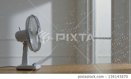 Vintage electric fan blowing soap bubbles across sunlit room, playful minimal surreal concept 136143870