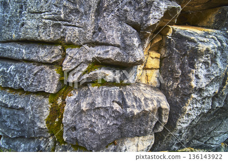 Rock Texture With Moss Detail And Weathered Stone Layers Close Up Rock Texture With Moss Detail And Weathered Stone Layers Close Up 136143922