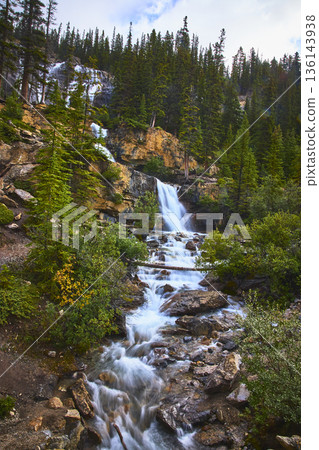Tangle Falls Waterfall Flowing Through Rocky Forest Landscape in Jasper Canada 136143938