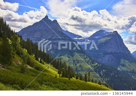 Montana Glacier National Park Rugged Mountain Peaks Lush Green Valley Scenic View Montana Glacier National Park Rugged Mountain Peaks Lush Green Valley Scenic View 136143944