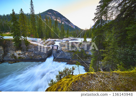 Natural Bridge Waterfall Flowing River and Forest Mountain Landscape 136143948