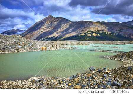 Mountain Lake and Moraine Landscape in the Canadian Rockies Near Athabasca Glacier Mountain Lake and Moraine Landscape in the Canadian Rockies Near Athabasca Glacier 136144032