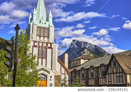 Historic Church and Tudor Architecture with Mountain Backdrop in Town of Banff Canada 136144141