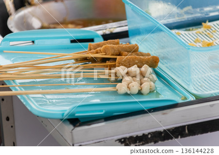 Indonesian street food skewers on blue tray for culinary travel concept Indonesian street food skewers on blue tray for culinary travel concept 136144228