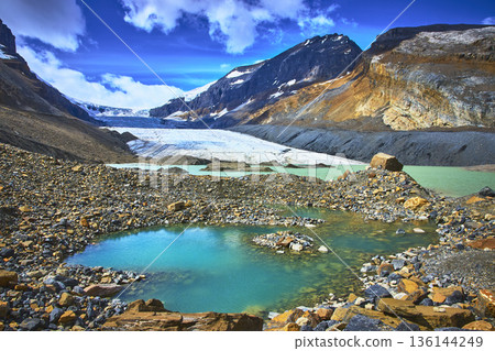 Athabasca Glacier Meltwater Pool and Rocky Mountain Landscape in Jasper National Park 136144249
