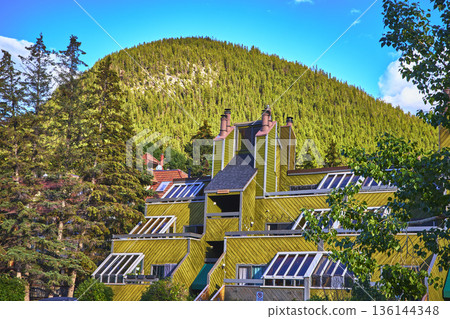 Modern Building and Forested Mountain in Summer Town of Banff Canada Modern Building and Forested Mountain in Summer Town of Banff Canada 136144348