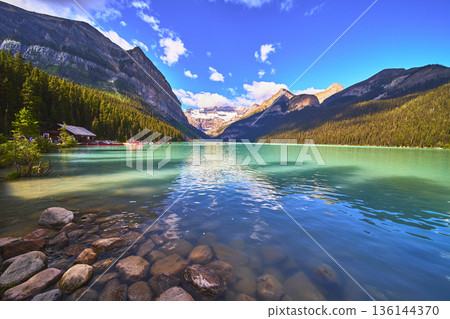 Lake Louise Turquoise Water Rocky Shore Mountain Peaks and Pine Forest Canada Lake Louise Turquoise Water Rocky Shore Mountain Peaks and Pine Forest Canada 136144370