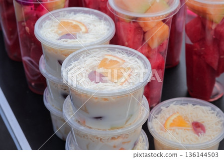 Es Buah Indonesia: Refreshing Fruit Cocktail with Shredded Cheese and Natural Light, showcasing traditional Indonesian Street Food Culture Es Buah Indonesia: Refreshing Fruit Cocktail with Shredded Cheese and Natural Light, showcasing traditional Indonesian Street Food Culture 136144503