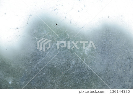Metallic Texture Displaying Scratches and Blurred Elements under Natural Light for Abstract Industrial Backgrounds Metallic Texture Displaying Scratches and Blurred Elements under Natural Light for Abstract Industrial Backgrounds 136144520