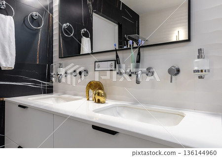 Modern Double Sink Bathroom Vanity with Black Marble and Gold Decor 136144960