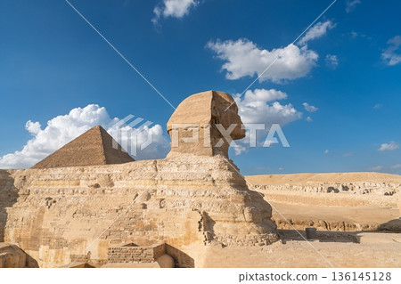 Majestic Great Sphinx of Giza and Pyramid under Blue Sky with White Clouds, Egypt Wonders Majestic Great Sphinx of Giza and Pyramid under Blue Sky with White Clouds, Egypt Wonders 136145128