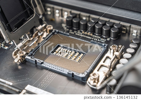 Close-up of a Modern CPU Socket on a Computer Motherboard for High-Performance Computing Close-up of a Modern CPU Socket on a Computer Motherboard for High-Performance Computing 136145132