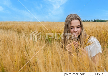Golden Grains Serene Young Woman Embracing Nature s Beauty in Wheat Field Landscape Golden Grains Serene Young Woman Embracing Nature s Beauty in Wheat Field Landscape 136145143