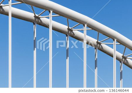 Steel frame pattern and shadow of water pipe bridge against the blue sky (geometric structure) Steel frame pattern and shadow of water pipe bridge against the blue sky (geometric structure) 136146044