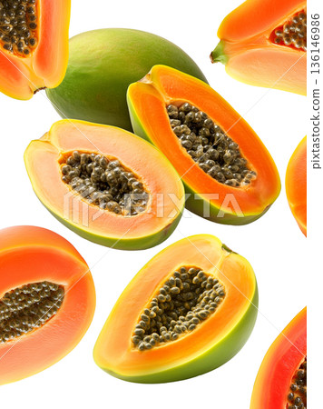 Multiple ripe papaya halves with dark seeds shown isolated on white background, representing a fresh tropical fruit concept Multiple ripe papaya halves with dark seeds shown isolated on white background, representing a fresh tropical fruit concept 136146986